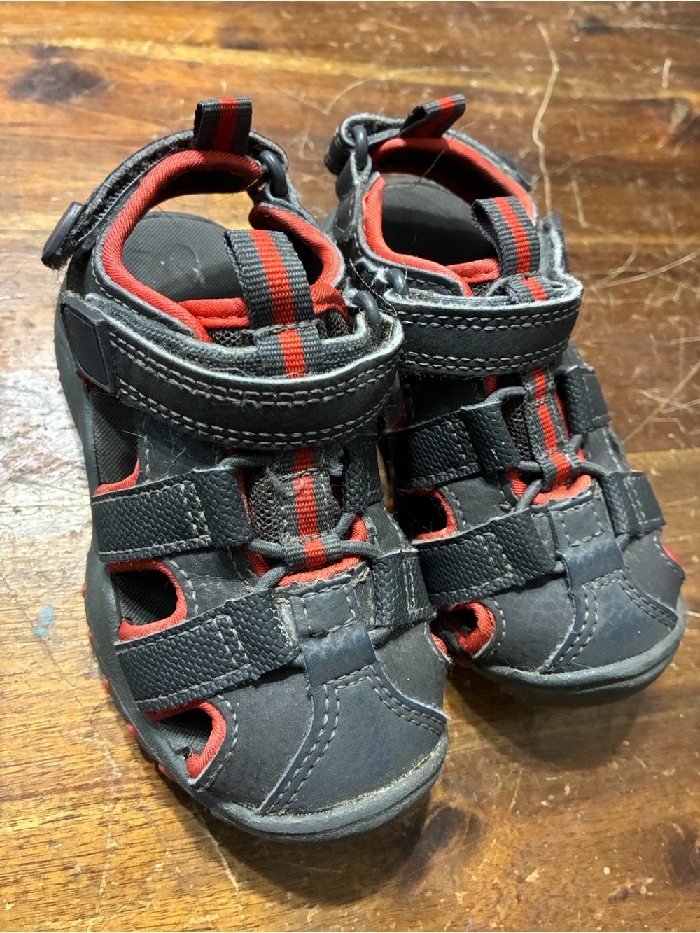 Kids Closed-Toe Sport Sandals in Black with Orange Accents